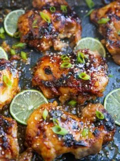 photo of honey lime chicken thighs all sticky and delicious in a casserole dish