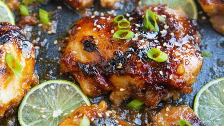 photo of honey lime chicken thighs all sticky and delicious in a casserole dish
