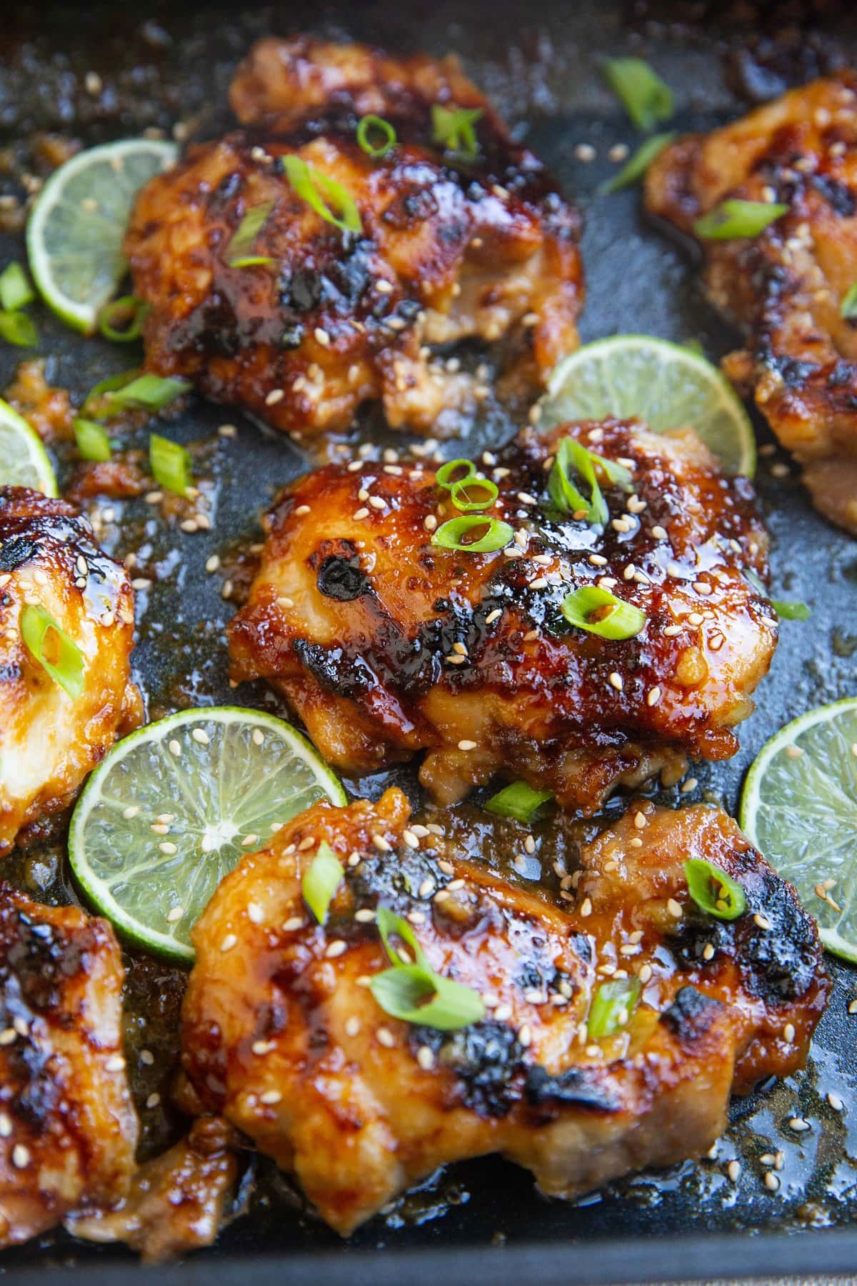 photo of honey lime chicken thighs all sticky and delicious in a casserole dish