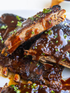 Stack of barbecue baked ribs on a platter