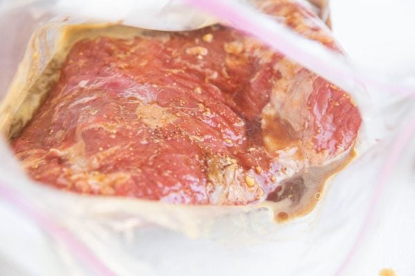 flank steak marinating in a bag