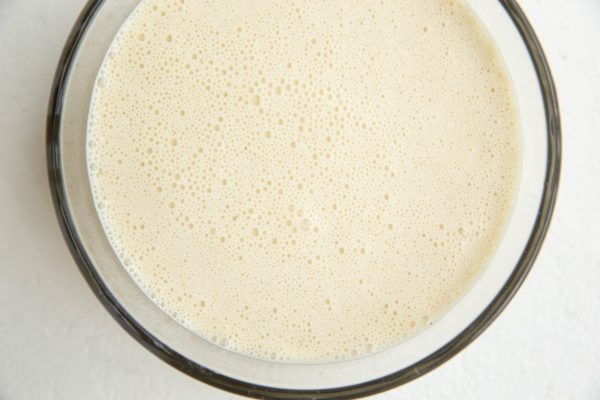 Crepe batter in a glass tupperware container