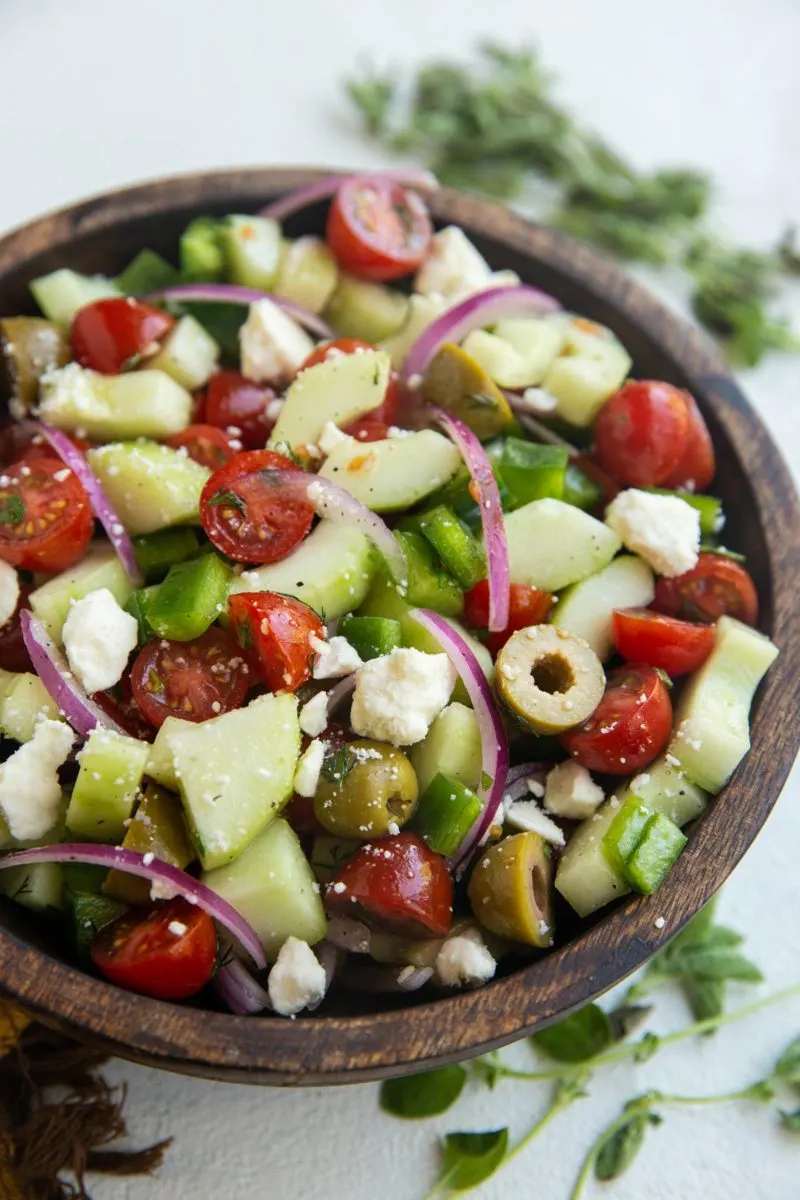Wooden bowl of fresh Greek Salad