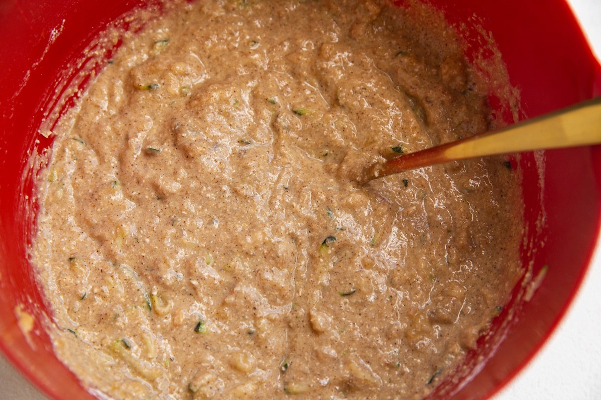 Zucchini banana bread batter in a mixing bowl.