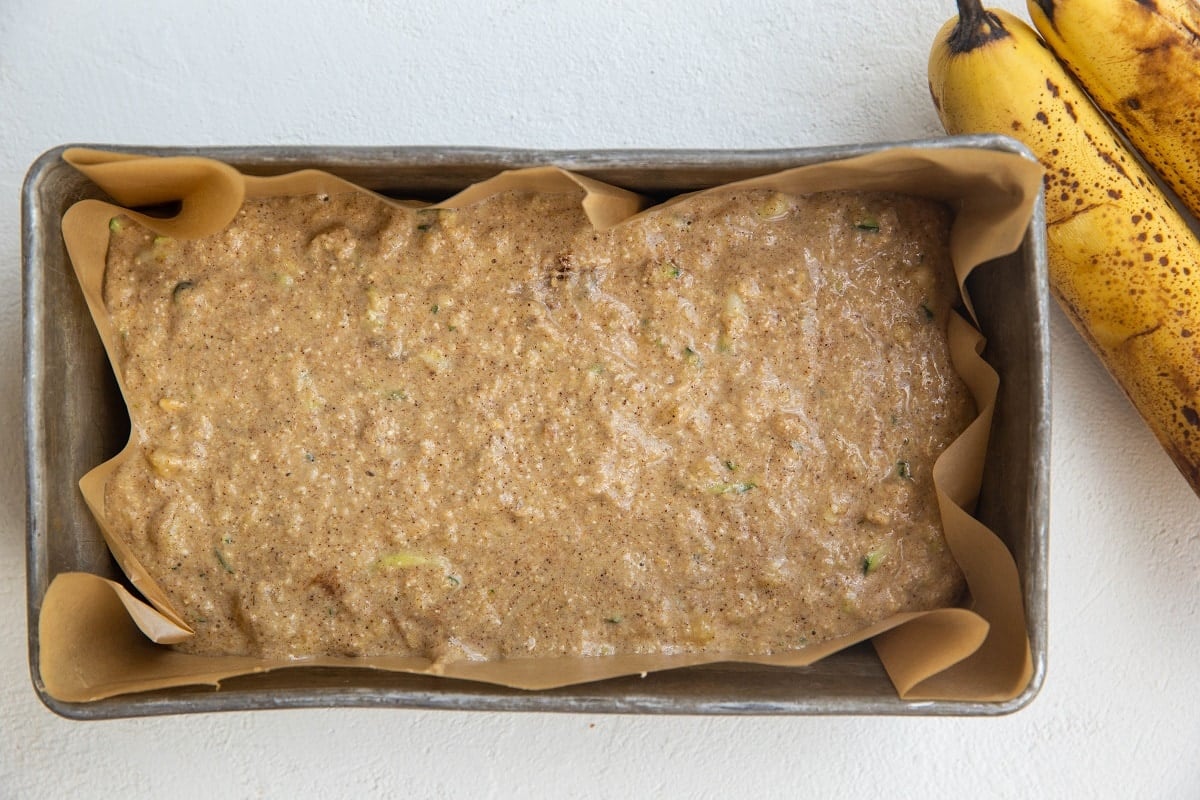 Batter for banana zucchini bread in a loaf pan, ready to go into the oven.