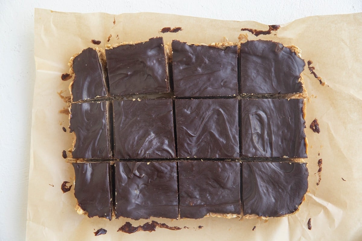 Sliced peanut butter oatmeal bars on parchment paper