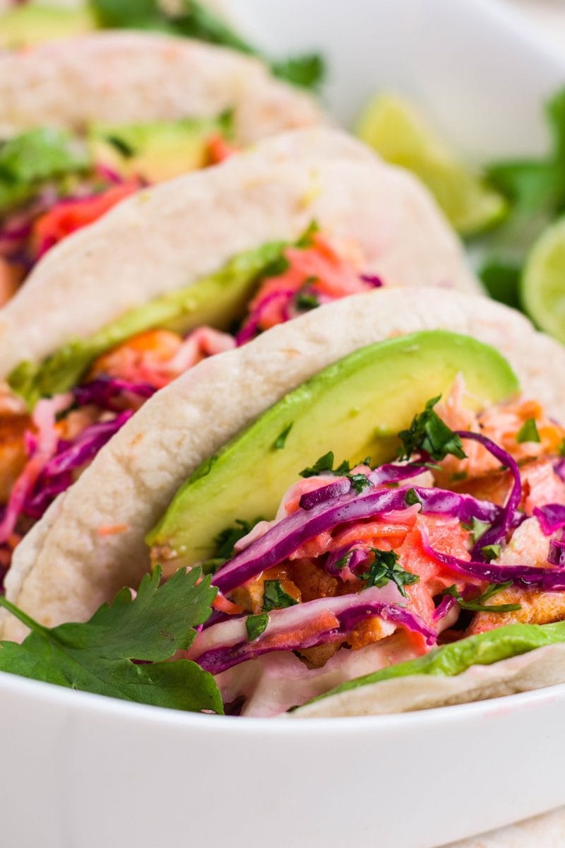 close up image of salmon tacos in a platter