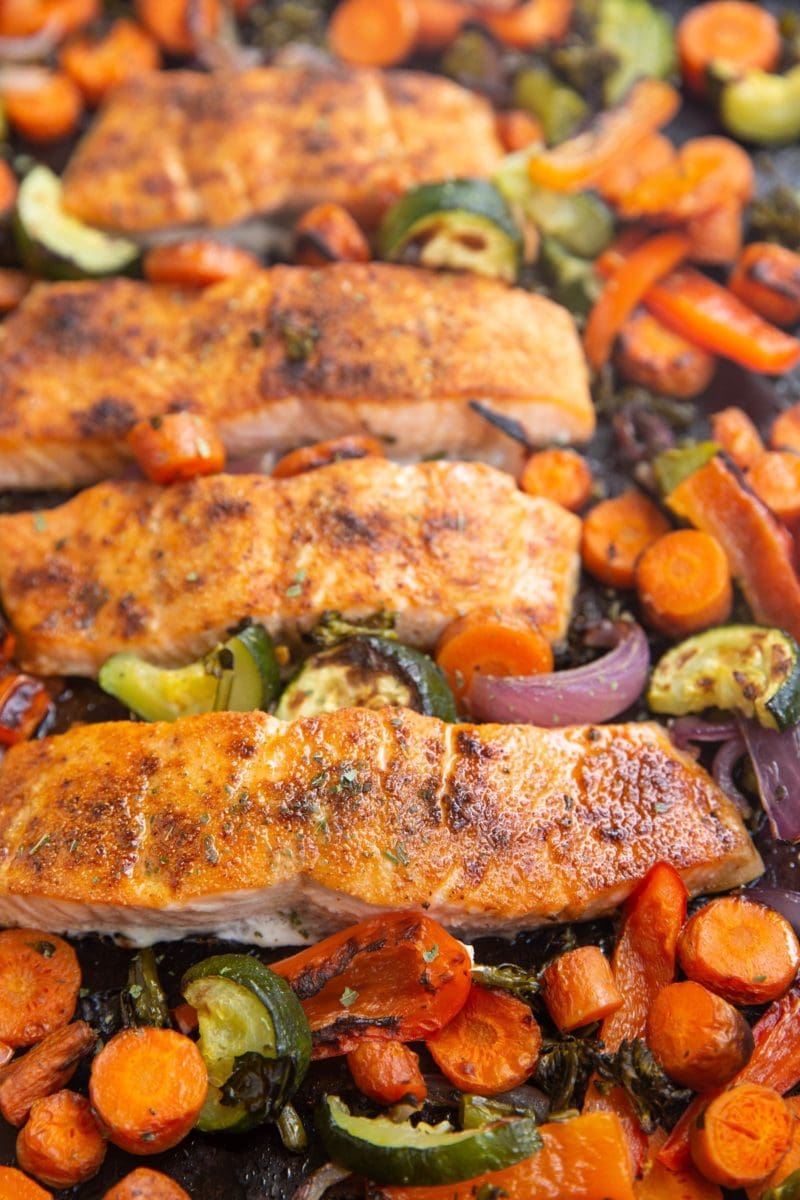 Large baking sheet of roasted salmon and roasted vegetables