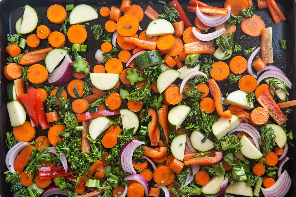 Sheet pan of raw chopped vegetables