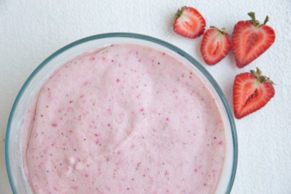 Frozen strawberry ice cream in a round container