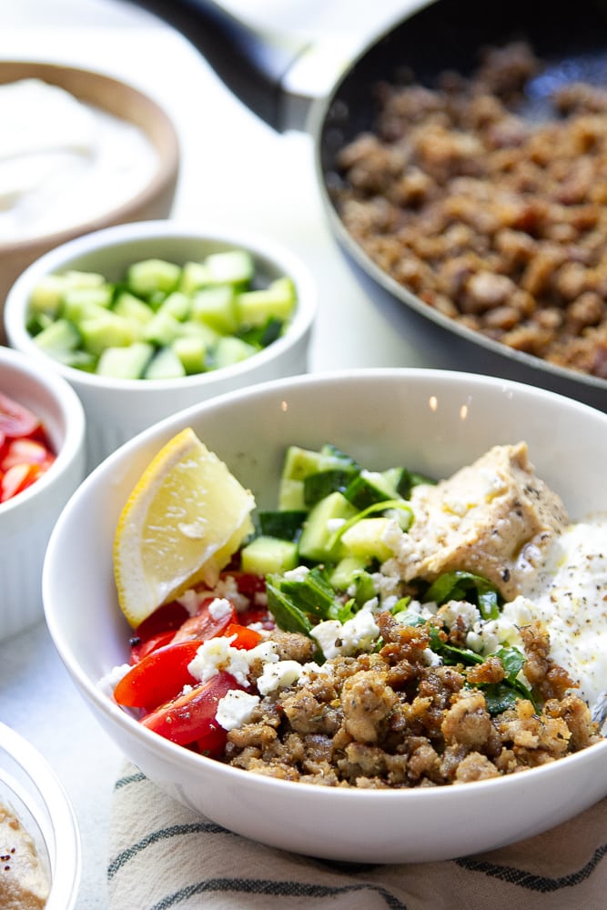 Mediterranean Turkey Bowls with ingredients in the background