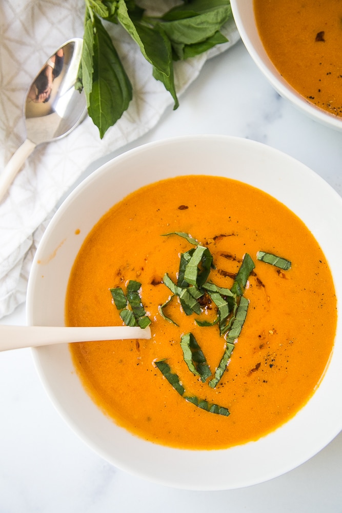 Two bowls of roasted tomato soup.