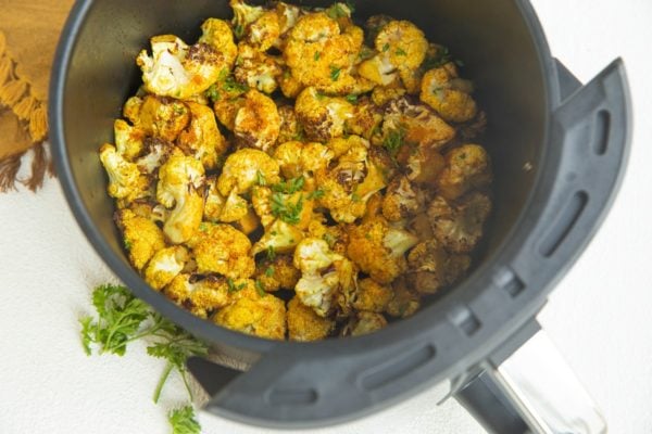 Finished curry cauliflower in an air fryer