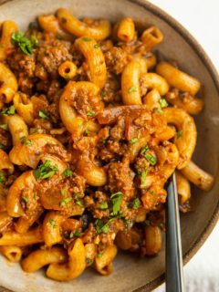 Big bowl of gluten-free dairy-free Hamburger Helper with a fork.