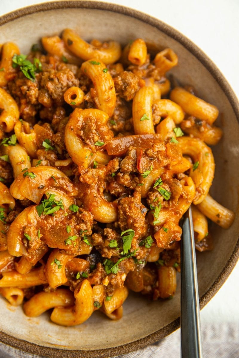 Big bowl of gluten-free dairy-free Hamburger Helper with a fork.