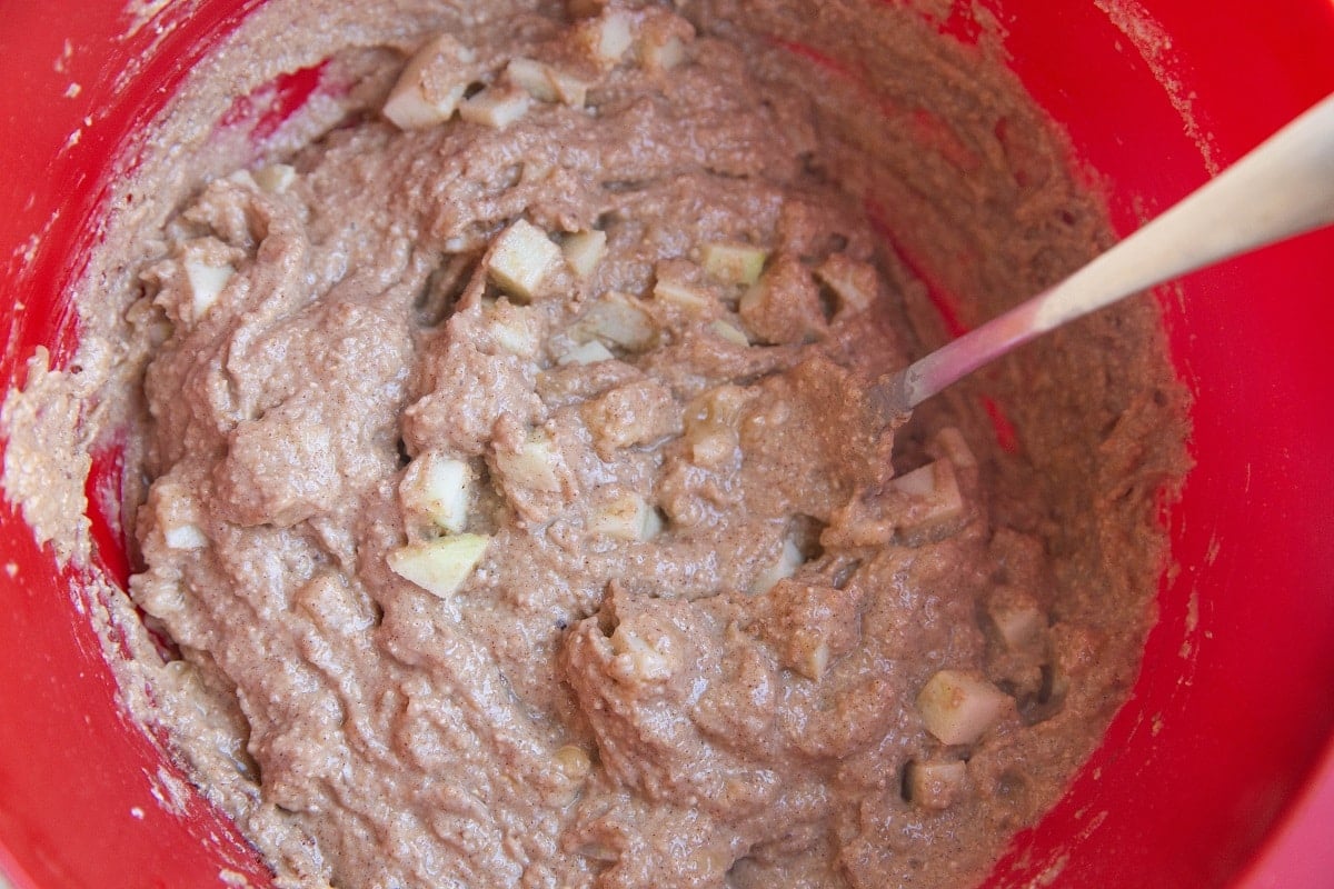 Apple muffin batter in a mixing bowl.