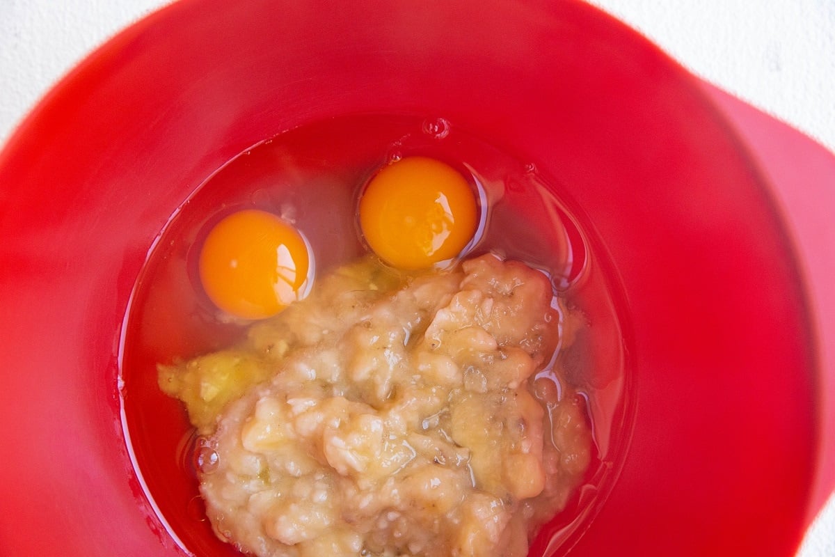 Wet ingredients for apple muffins in a mixing bowl