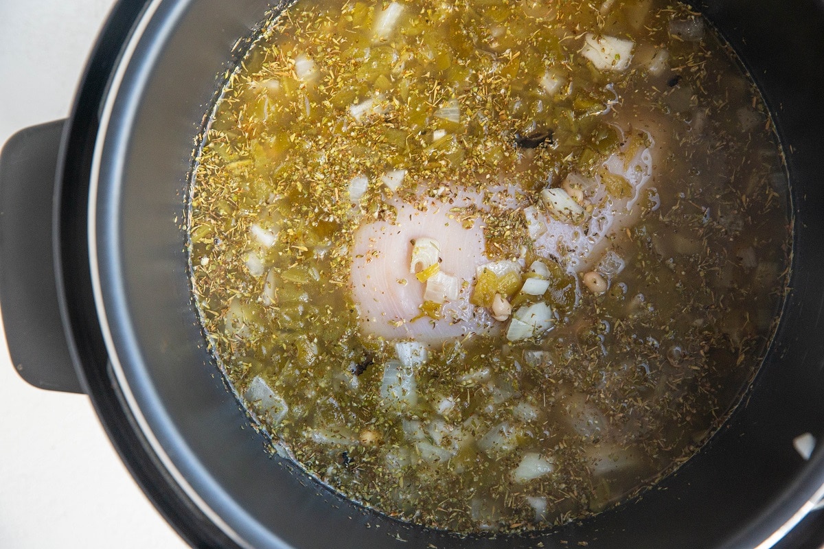 Ingredients stirred up in an instant pot, ready to be pressure cooked.