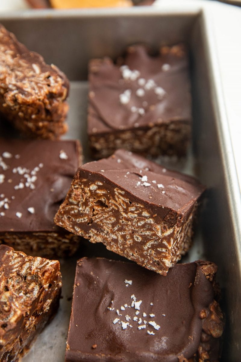 Cut bars of crispies treats in a baking dish.