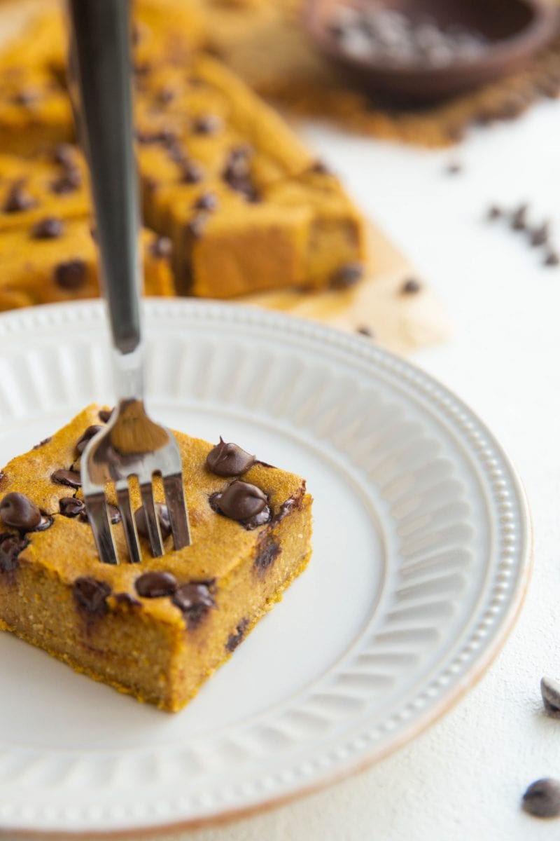 Fork taking a bite out of a square of pumpkin baked oats