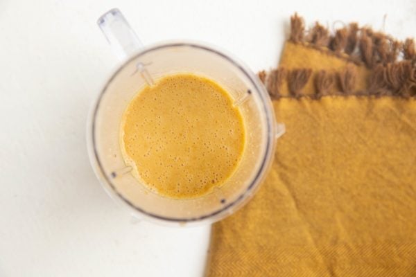 Peanut dressing in a blender, ready to go on the salad.