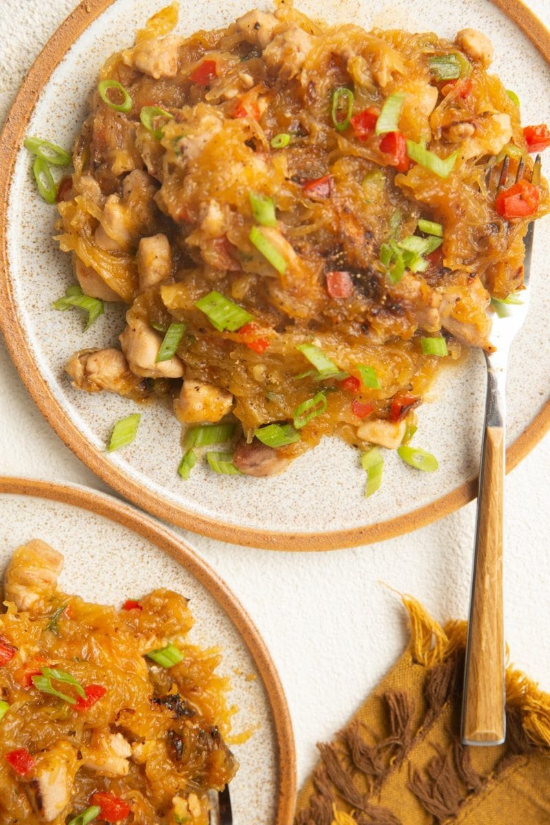 Top down image of two plates of spaghetti squash drunken noodles.