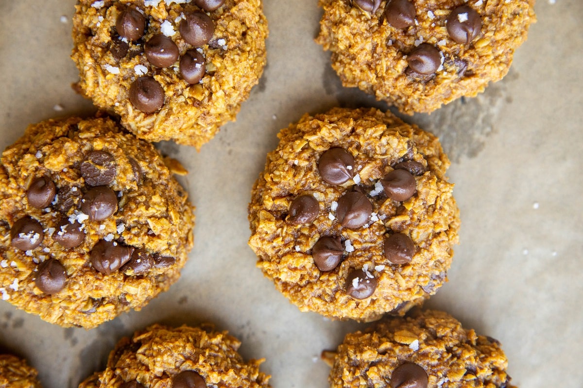 horizontal photo of pumpkin cookies fresh out of the oven.