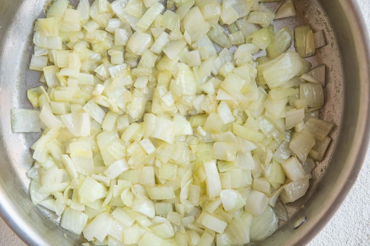 Onion sautéing in a stainless steel skillet