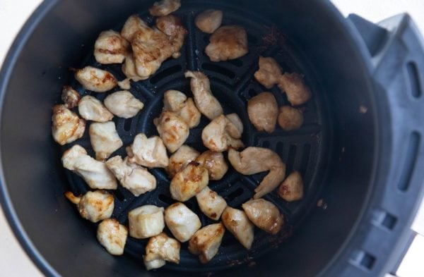Cooked air fryer chicken bites in an air fryer, ready to serve.