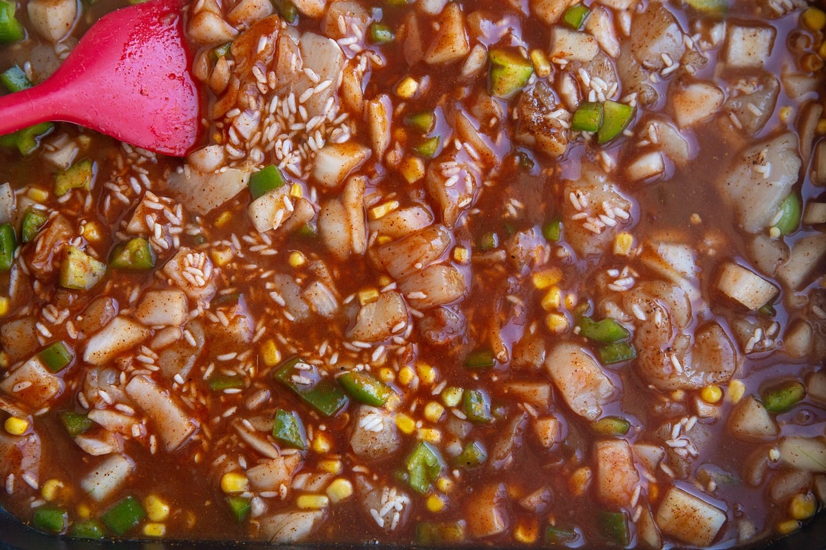 All of the casserole ingredients stirred up in the dish