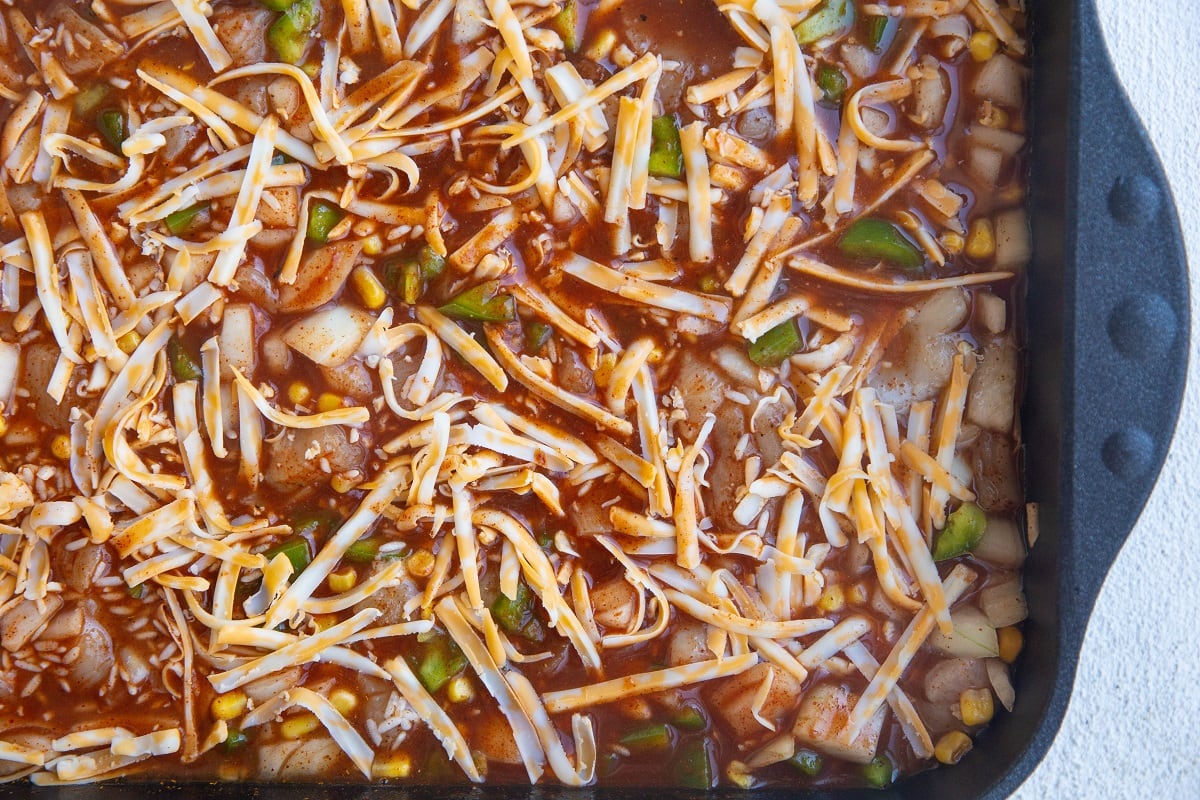 Half of the grated cheese stirred into the casserole