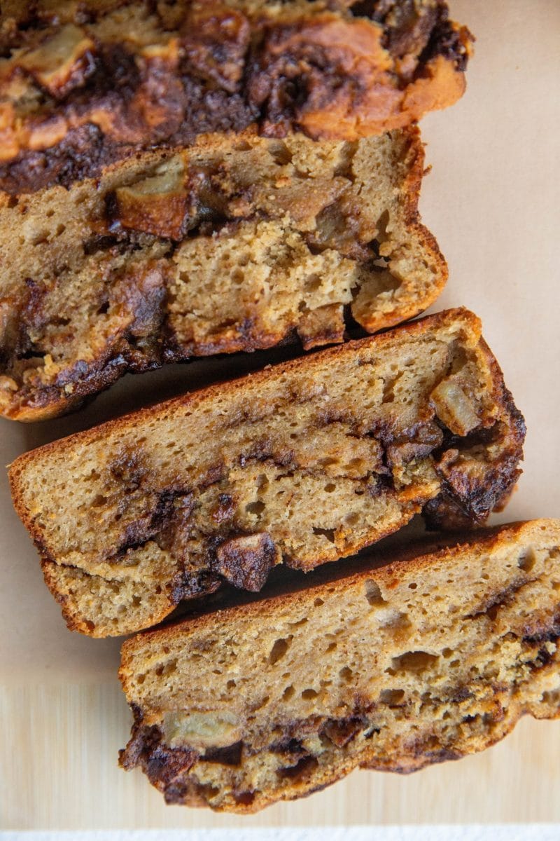 Close up image of apple bread slices on a cutting board.