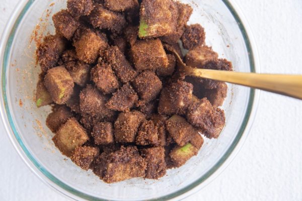 Mixing bowl with apples and cinnamon for the apple cinnamon layer of the bread