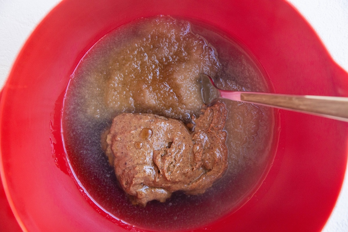 Wet ingredients for apple bars in a mixing bowl.