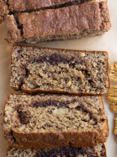 Sliced loaf of cinnamon swirl banana bread.