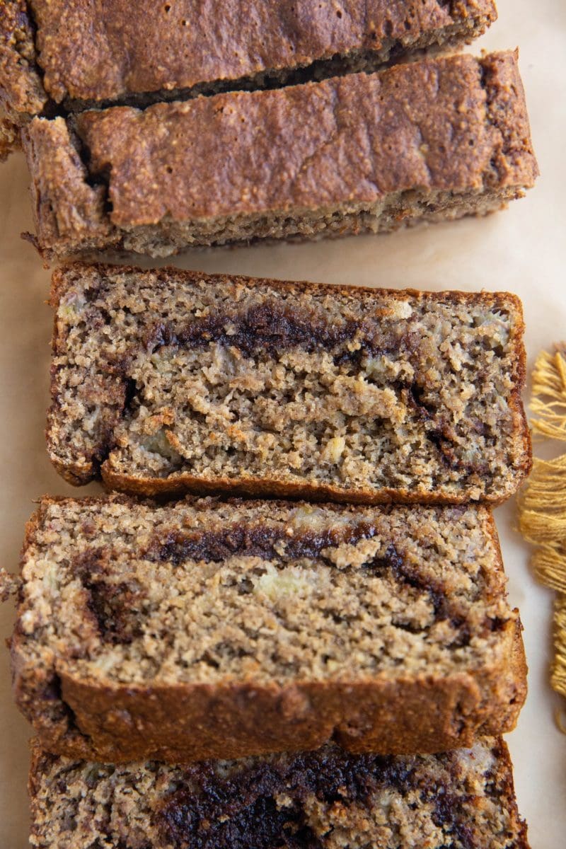 Sliced loaf of cinnamon swirl banana bread.