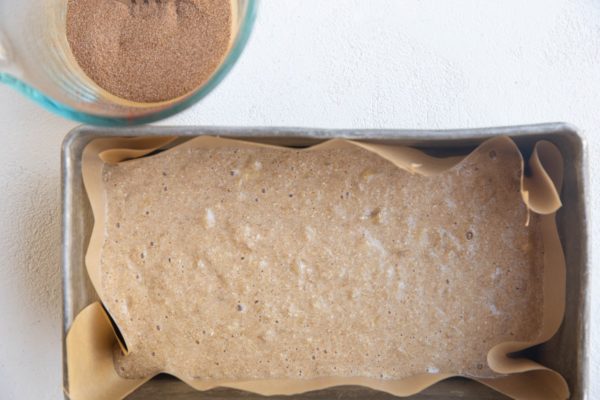 Half of the batter in a loaf pan.