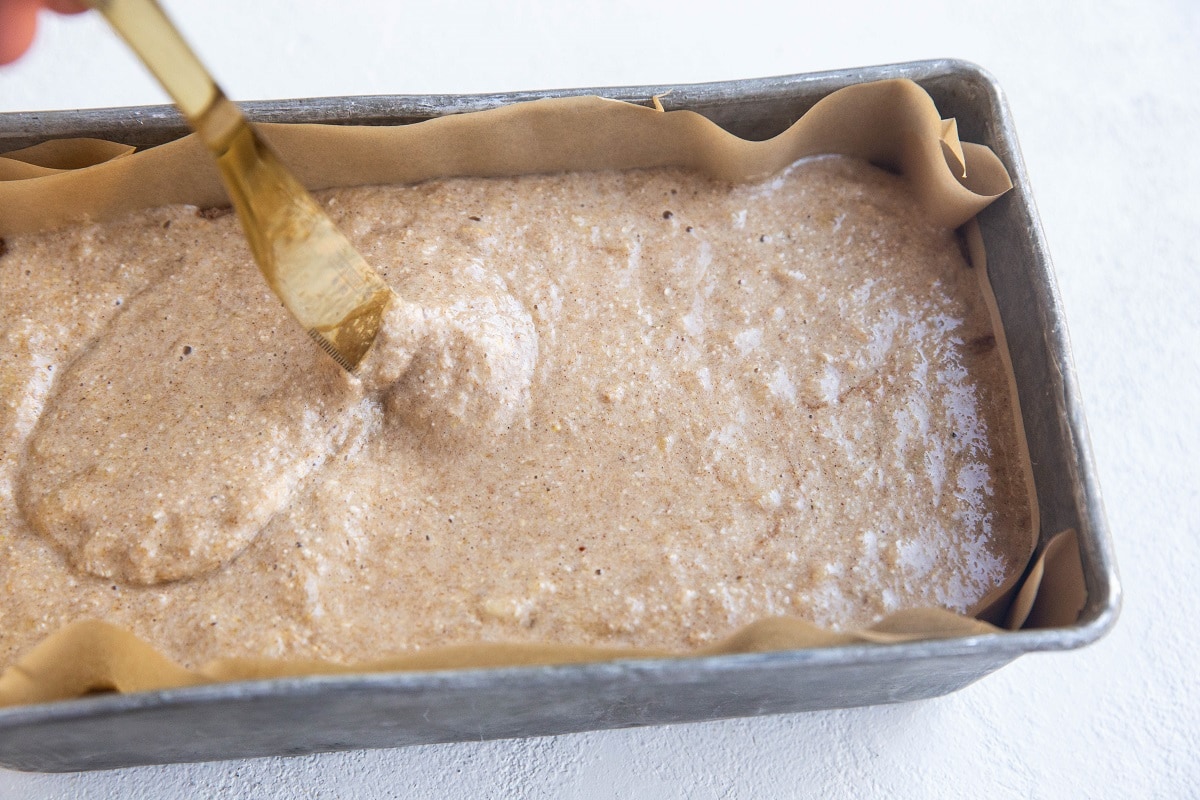 butter knife drawing an S shape into the banana bread batter.