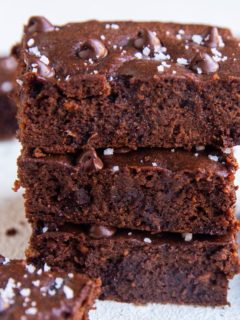 Stack of sweet potato brownies - a closeup on the brownies sprinkled with sea salt.