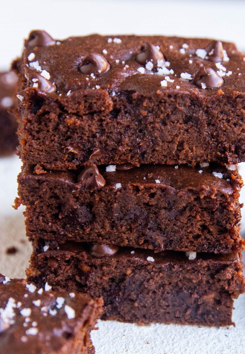 Stack of sweet potato brownies - a closeup on the brownies sprinkled with sea salt.