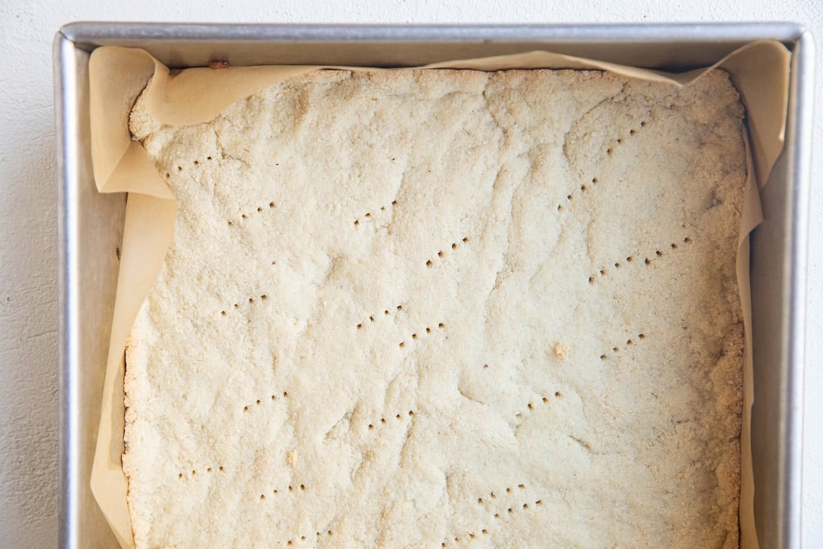 Baked crust in a baking pan, ready to be filled with pie filling.