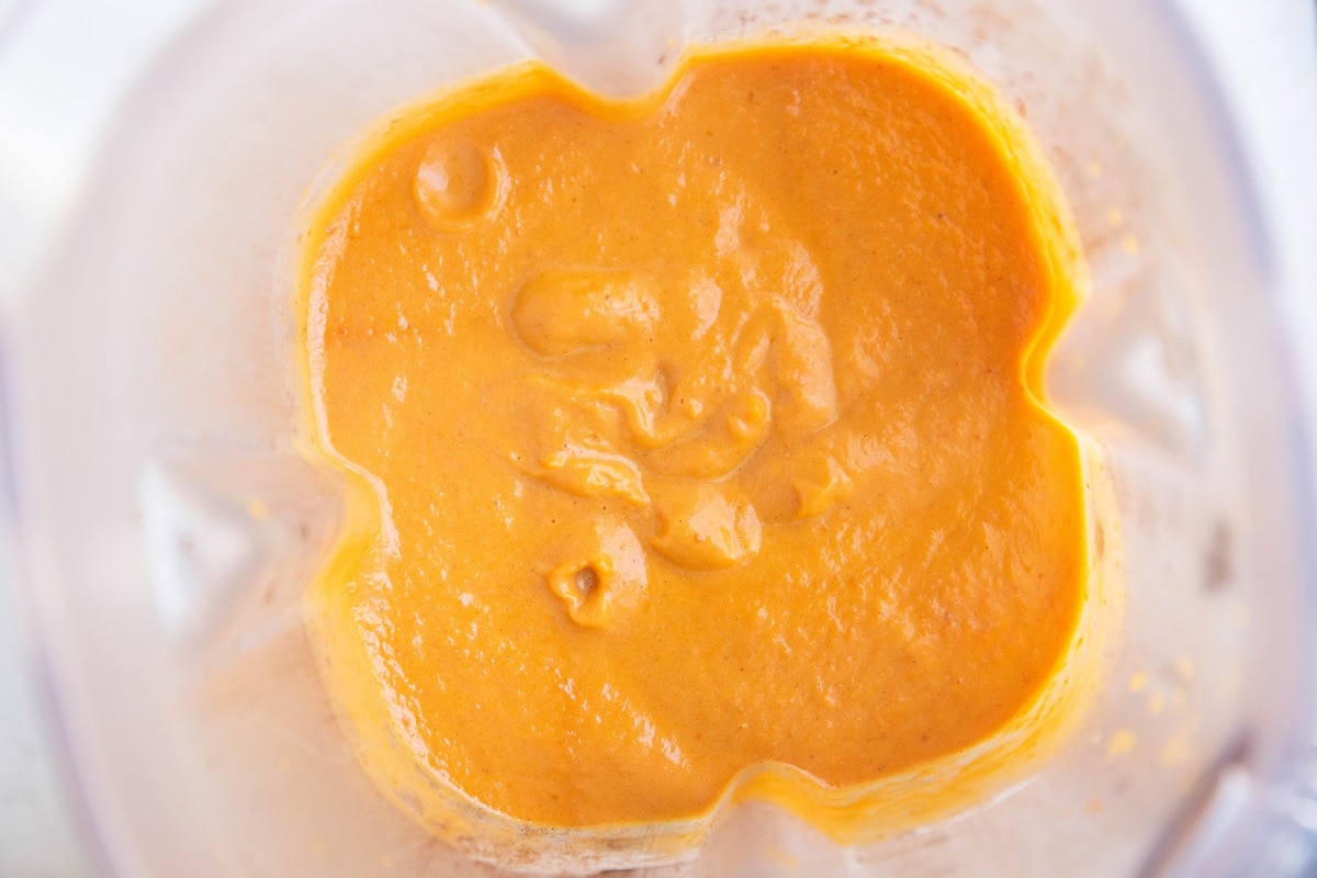 Blended pumpkin pie filling mixture in a blender.