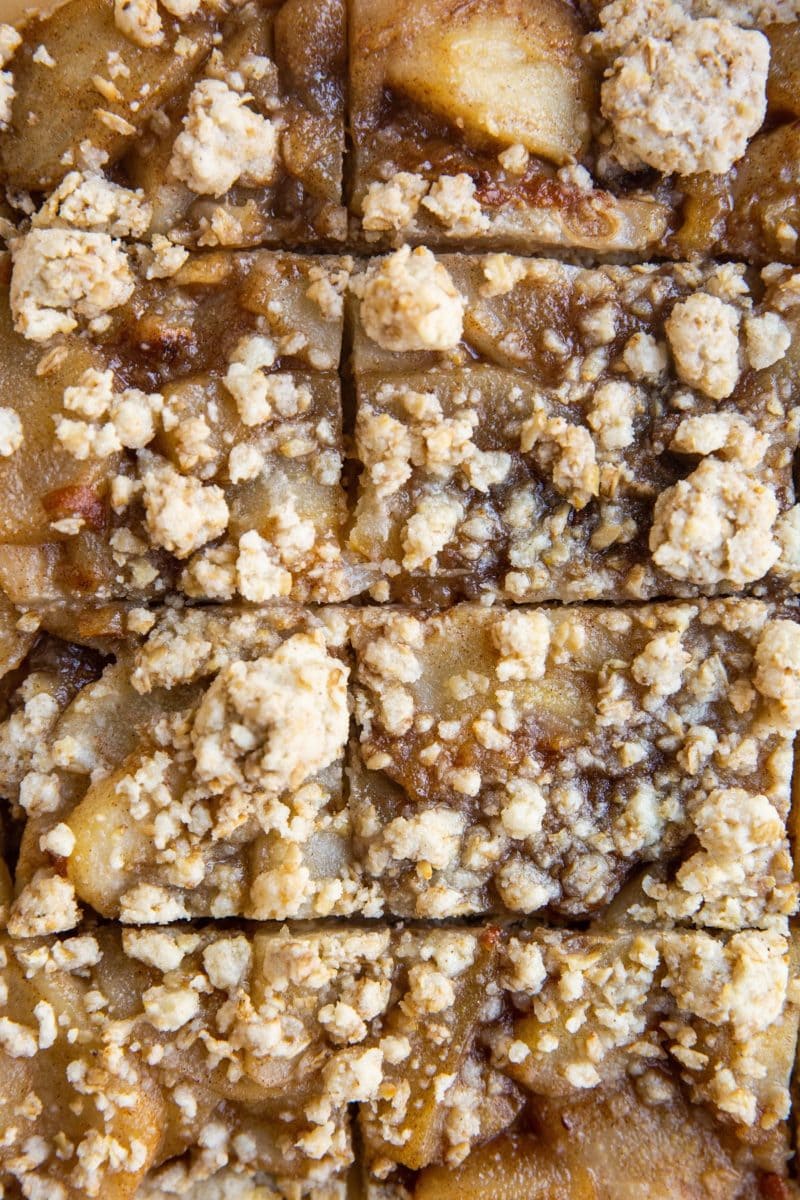 Vertical image of sliced pear crumb bars on parchment.