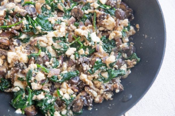 Feta cheese stirred in with the spinach, mushrooms, garlic, and onion.