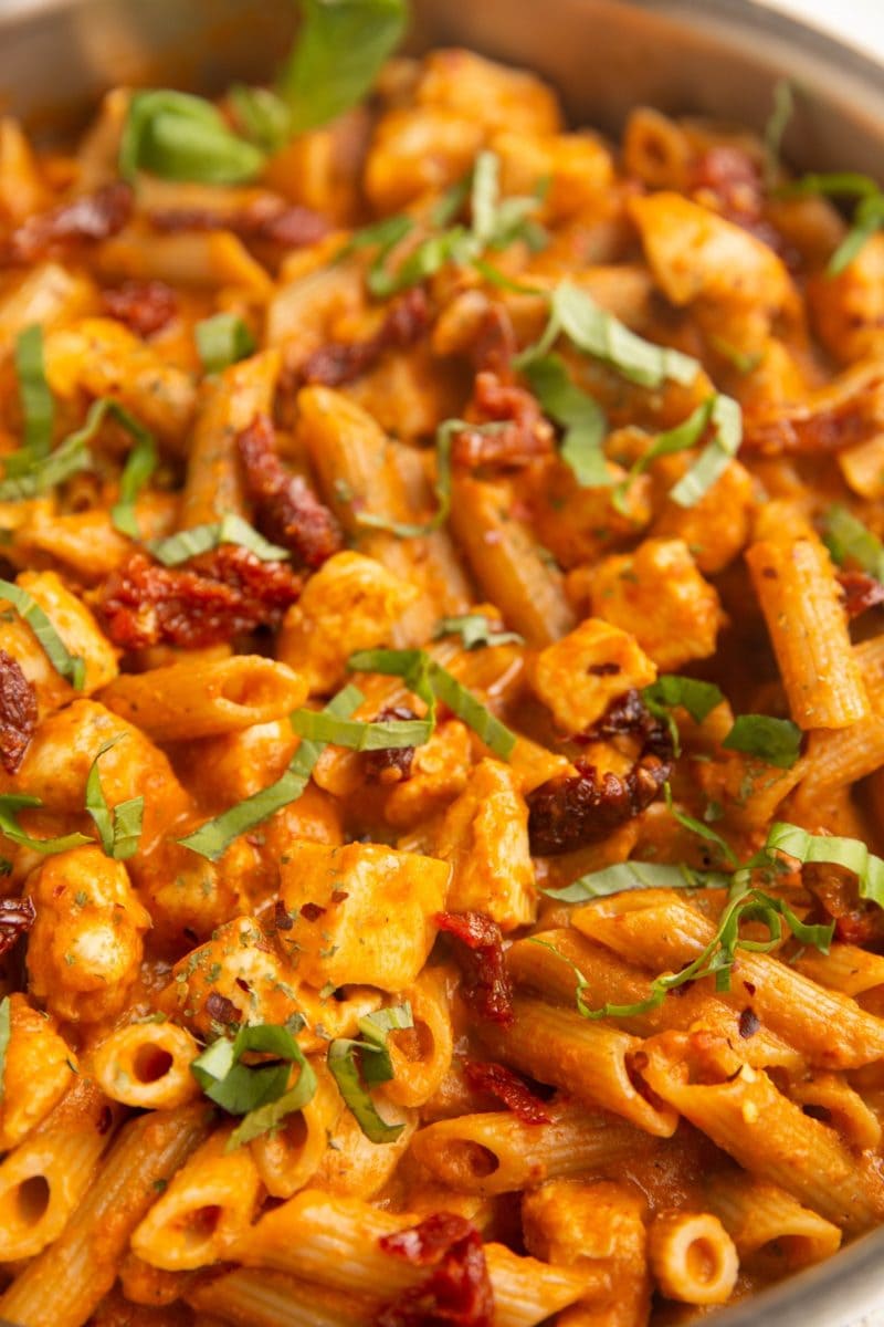 Close up photo of sun-dried tomato chicken pasta.