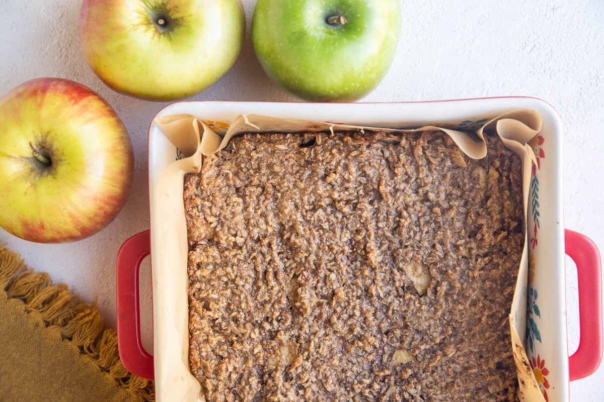 apple oatmeal bars in a baking sheet, fresh out of the oven.