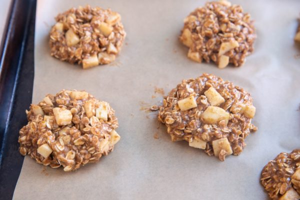 Apple Oatmeal Cookie dough on a baking sheet, ready to go into the oven.