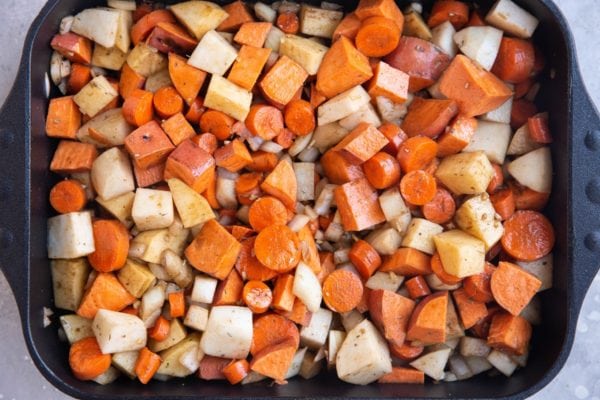 All of the ingredients for the roasted veggies in a casserole dish.