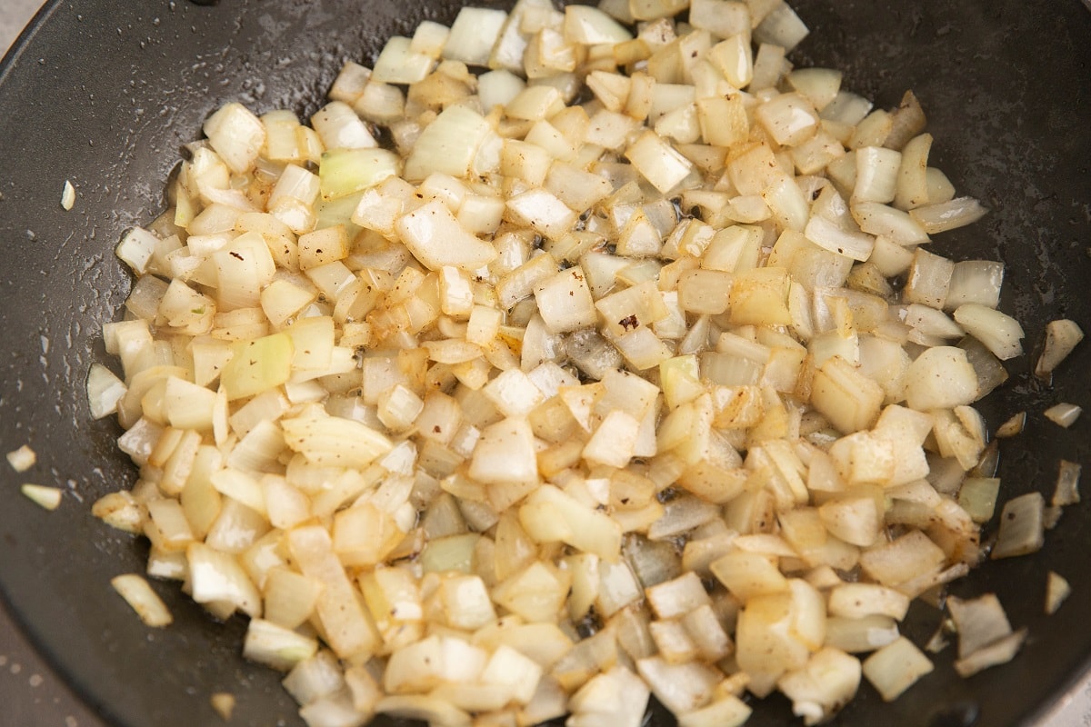 Onions sautéing in a skillet