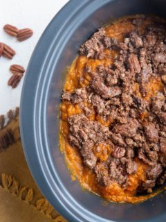 Top down photo of whole crock pot with slow cooker sweet potato casserole inside.